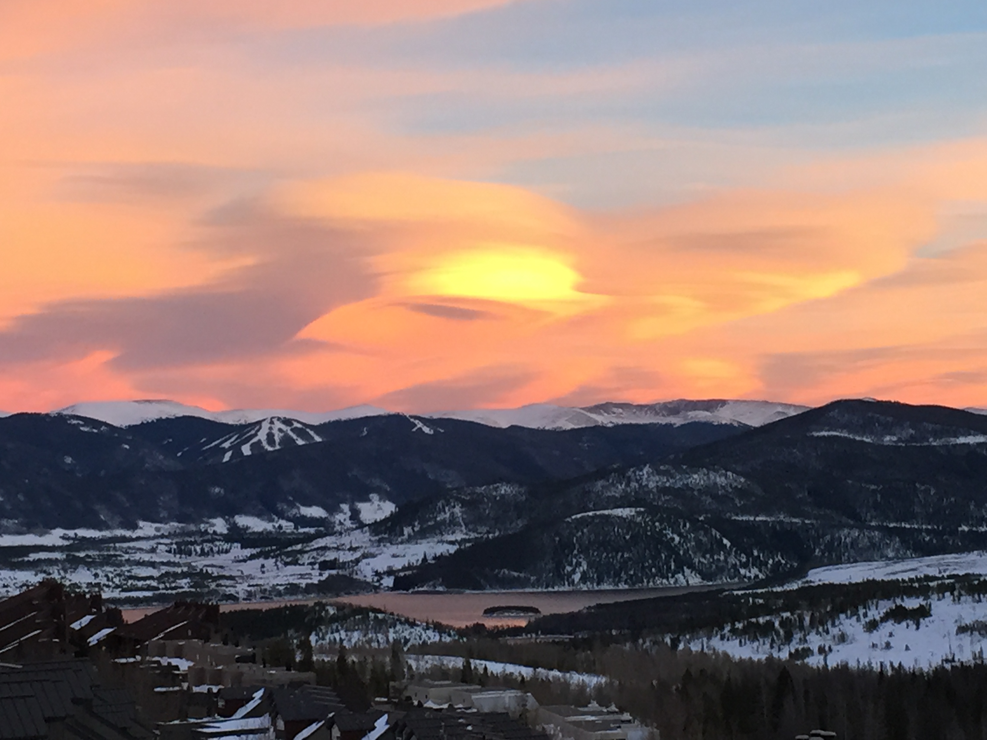 Snow-covered mountains rising above a lake near Silverthorne, Colorado